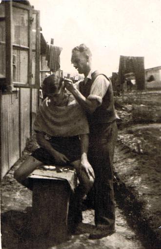 Cutting hair at Stalag 383, 1944