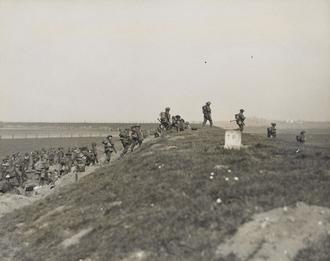 Gordons advance over flood bank, Rhine, 24 Mar 1945