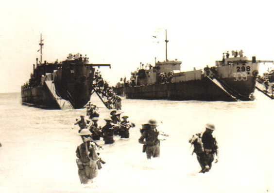 Men walking ashore, Sicily, July 1943